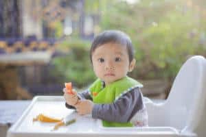 baby eating using a baby led weaning approach ages 6 to 12 months